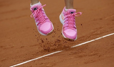 Pink tennis shoes.